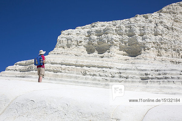 Visitor admiring the white limestone cliffs of the Scala dei Turchi  Realmonte  Porto Empedocle  Agrigento  Sicily  Italy  Mediterranean  Europe