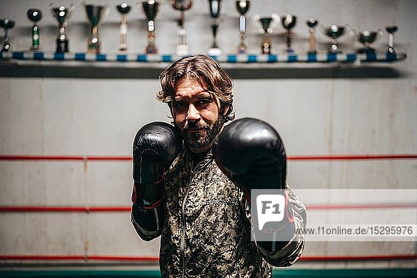 Boxer training in boxing ring