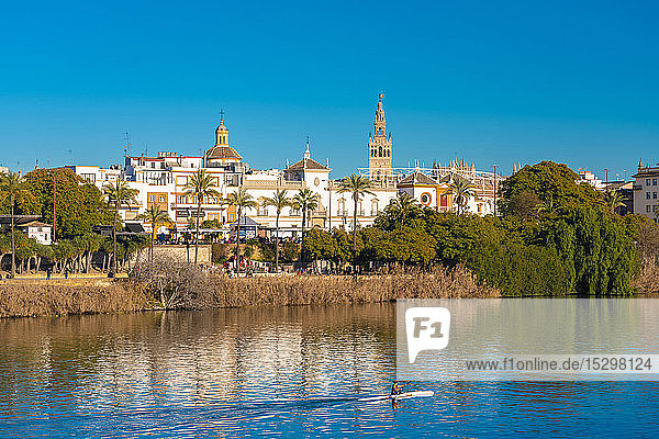 Cityscape with Guadalquivir river Cathedral of Seville with La Giralda Seville Spain