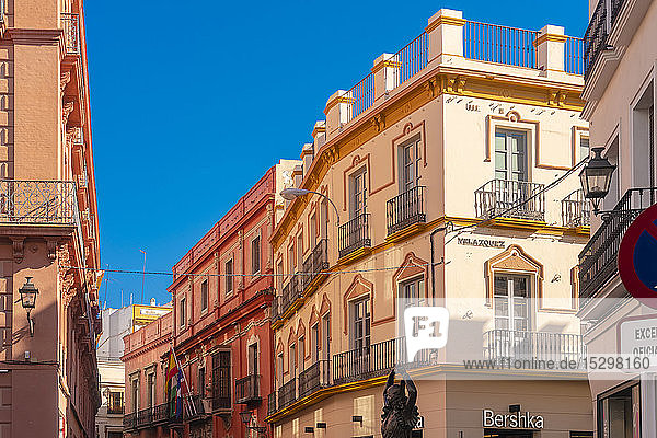 Historical buildings at the old city center with a Flamenco dancer statue Seville Spain