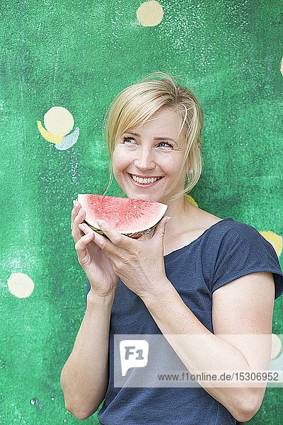 Portrait carefree  happy woman eating watermelon