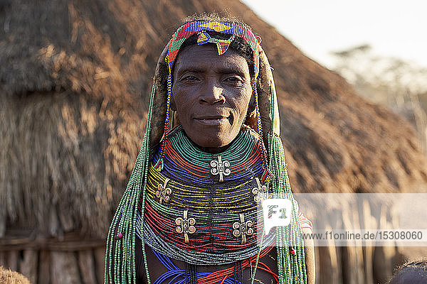Muhila woman with her characteristic hairstyle and necklaces  Kehamba  Chibia  Angola.