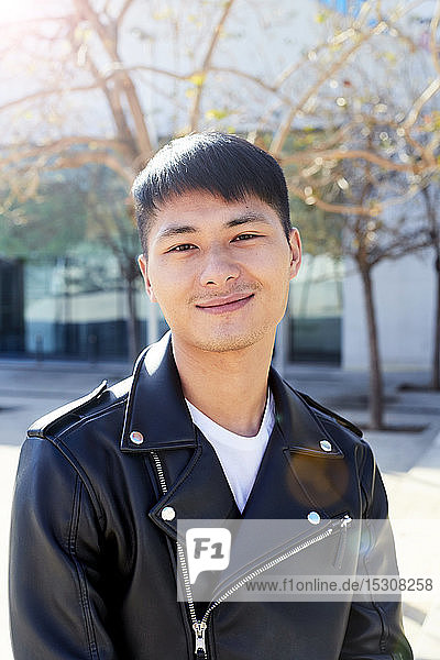 Portrait of confident young man wearing a leather jacket  Barcelona  Spain