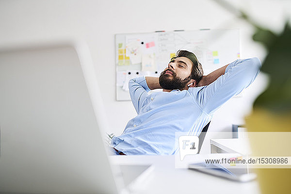 Businessman relaxing at a desk