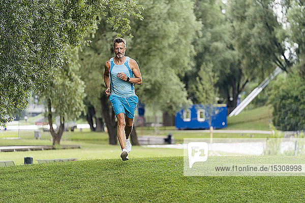 Sporty man jogging in a park