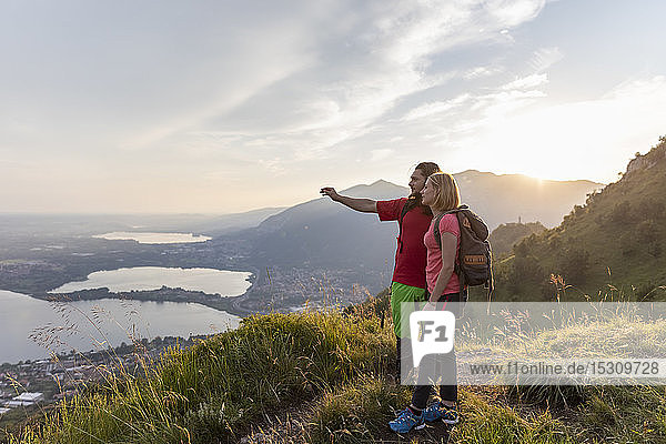 Young couple in the mountains  looking at view