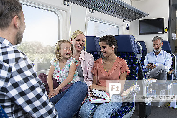 Carefree family traveling in a train