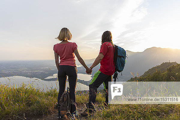 Young couple in the mountains  looking at view