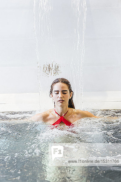 Woman enjoying the whirpool in a spa
