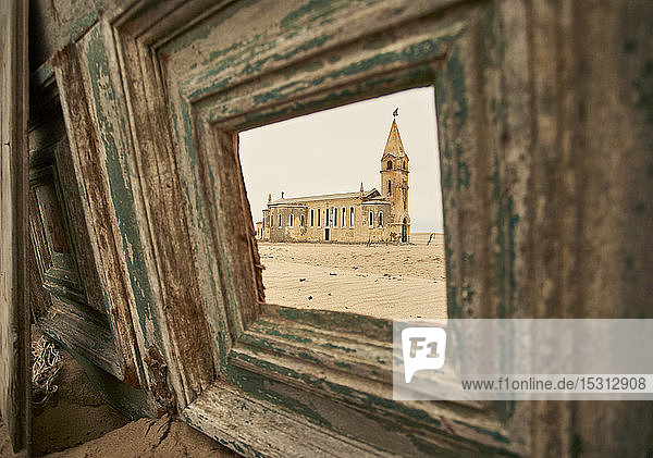 View through a window of the church at the abandoned village of Ilha dos Tigres  Angola.