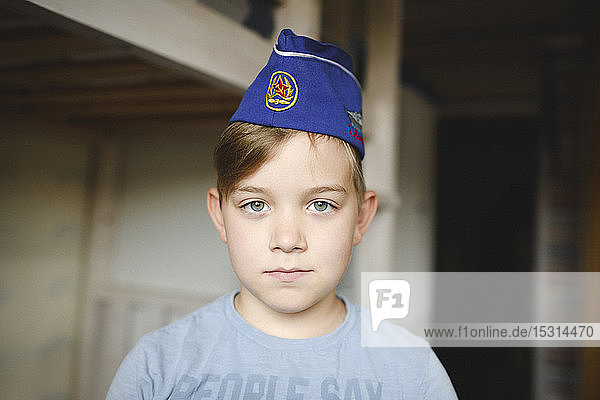 Portrait of a boy wearing a Russian cap