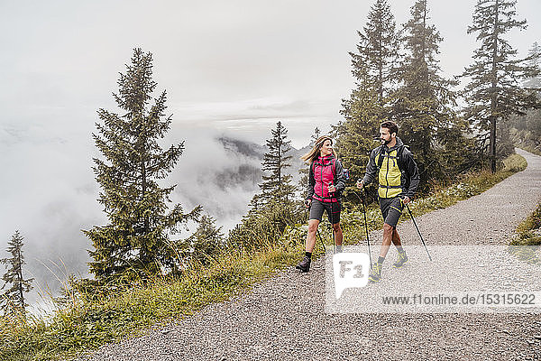 Young couple on a hiking trip in the mountains  Herzogstand  Bavaria  Germany