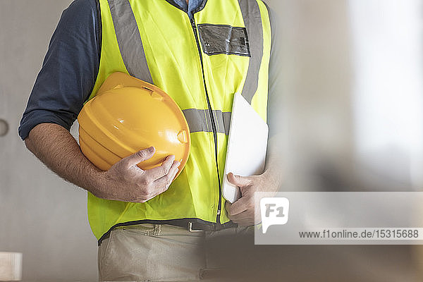 Architect with hardhat and safety vest