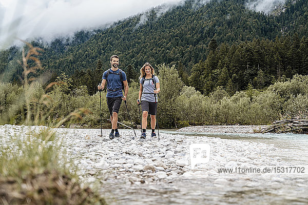 Young couple on a hiking trip at riverside  Vorderriss  Bavaria  Germany