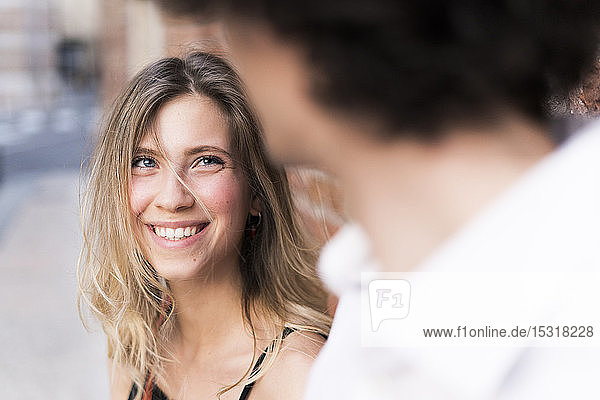 Happy young woman in love looking at boyfriend