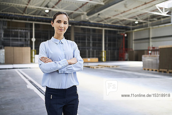 Portrait of confident businesswoman in a factory