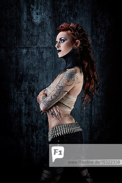 Young tattooed woman  one-eyed  profile