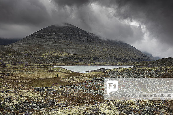 Lake by mountain in Rondane National Park Norway