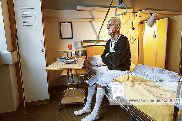 Senior man on hospital bed