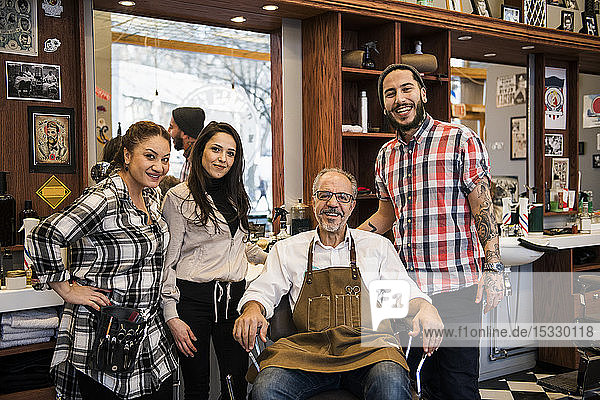 Portrait of barbers in barbershop