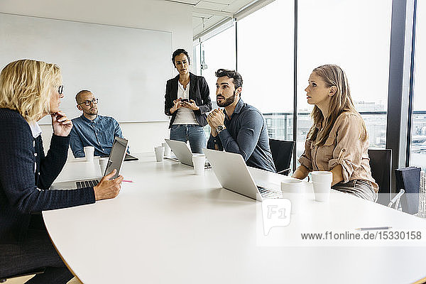 Businesspeople during meeting in conference room