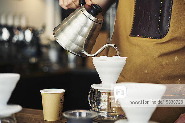 Barista making coffee