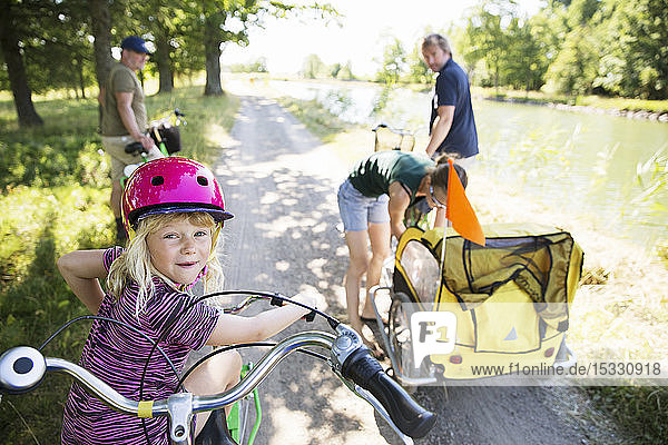 Family cycling by canal