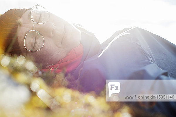 Woman napping in sunlight