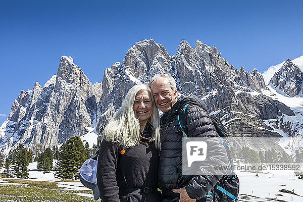 Smiling couple by mountain in Dolomites  Italy