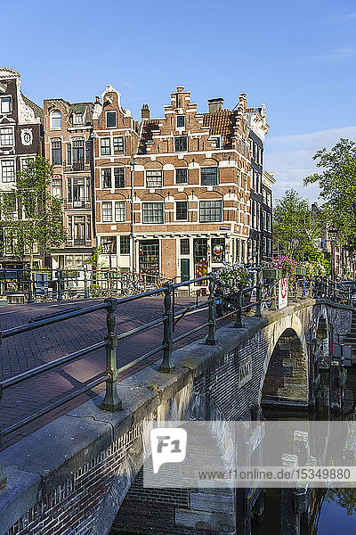 Old gabled buildings by a bridge on Prinsengracht  Amsterdam  North Holland  The Netherlands  Europe