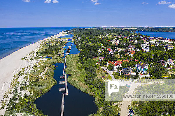 Aerial by drone of a boardwalk in a little lake on the coast of Yantarny Kaliningrad Russia Europe