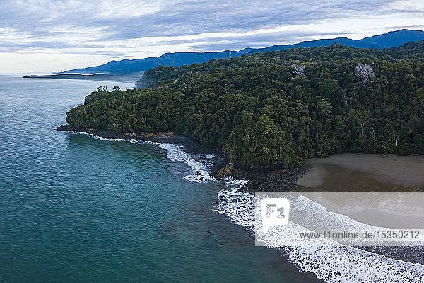 Drone view of Arco Beach and rainforest at sunrise  Uvita  Puntarenas Province  Pacific Coast of Costa Rica  Central America