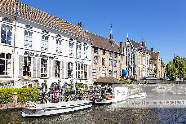 Boat tours on The Den Dijver Bruges canal in front of the Hotel De Orangerie in Bruges  Belgium  Europe