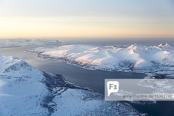 Aerial view  snow-covered mountains with fjord  province Tromsö  Tromsö  Norway  Europe