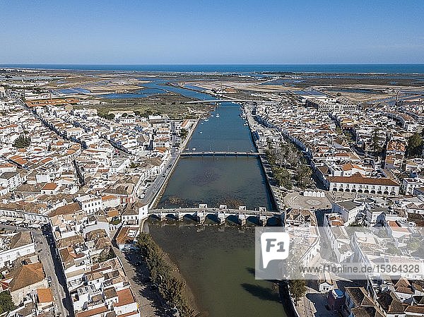 City view with roman bridge over Gilao river in old fishermen's town Tavira  drone shot  Algarve  Portugal  Europe
