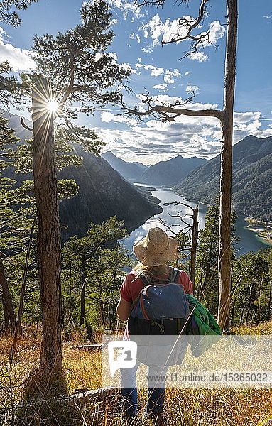 Young hiker at the view from Schönjöchl  Lake Plansee surrounded by mountains  Tyrol  Austria  Europe