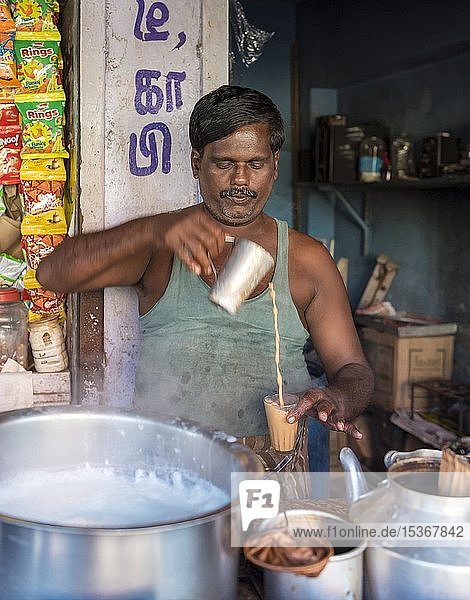 Man makes masala tea at a street stall  Mahabalipuram  Mamallapuram  India  Asia