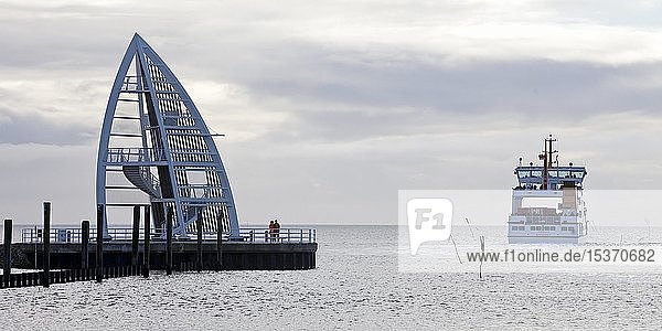 Observation tower at the harbour and departing ferry  landmark  Juist Island  East Frisia  Lower Saxony  Germany  Europe
