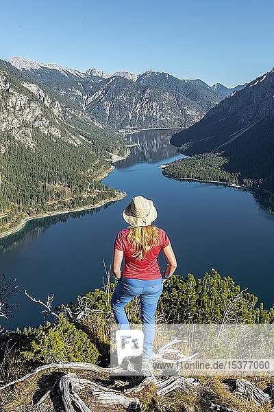 Female hiker looks into the distance  behind Schönjöchl  Lake Plansee  Ammergauer Alps  district Reutte  Tyrol  Austria  Europe