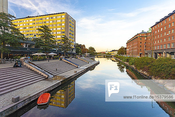Canal amidst buildings against sky in Malmo  Sweden