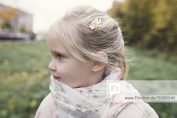 Blond little girl wearing Chamomile in her hair