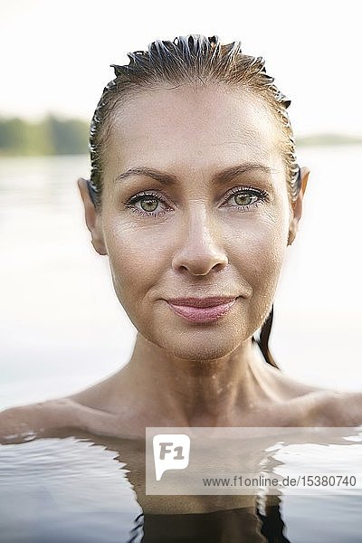 Portrait of mature woman in a lake