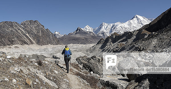 Young woman hiking in Sagarmatha National Park  Everest Base Camp trek  Nepal