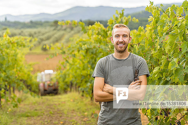 Portrait of confident young man in vineyard