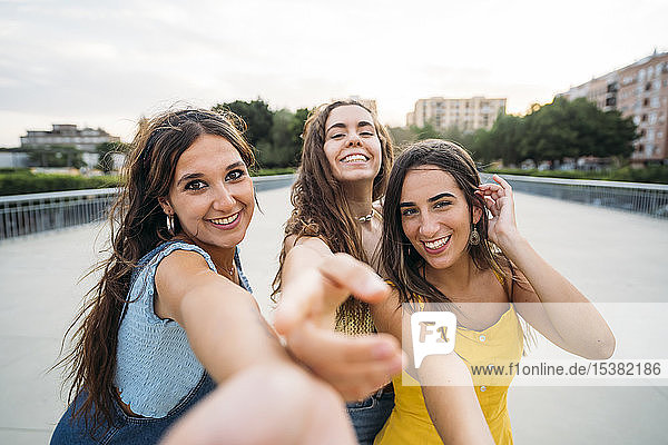 Point of view shot of three happy female friends