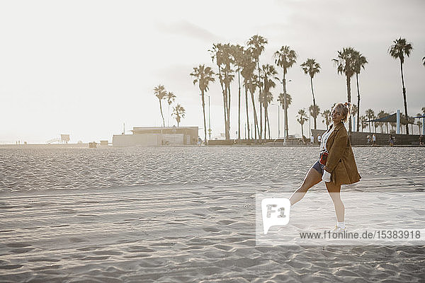 Happy young woman on the beach  Venice Beach  California  USA