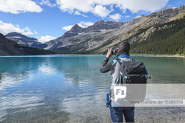 Canada  Jasper and Banff National Park  Icefields Parkway  man at lakeside
