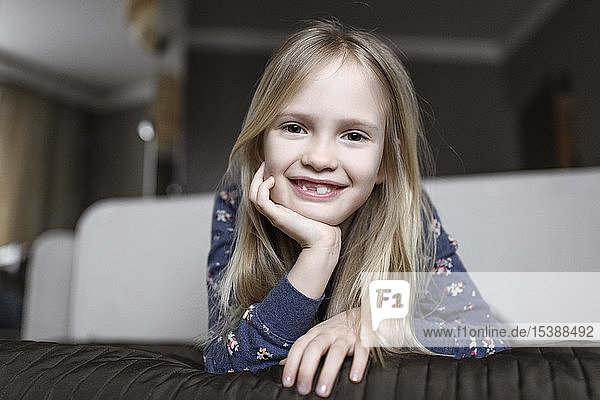 Portrait of smiling little girl with tooth gap