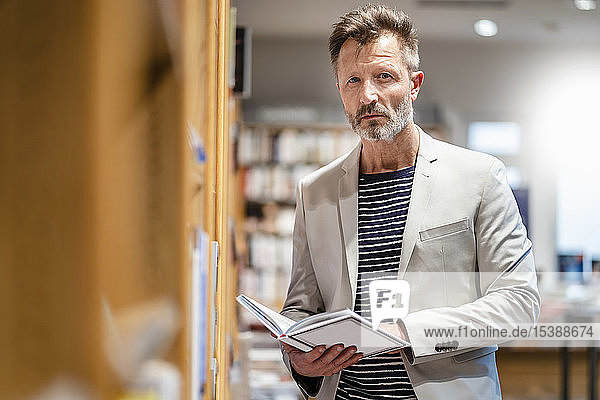 Portrait of mature man in a bookshop
