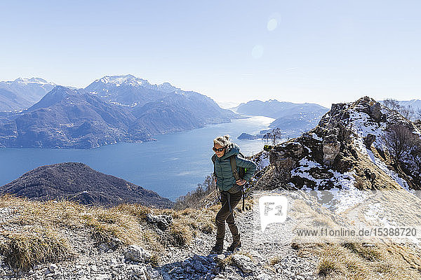 Italy  Como  Lecco  woman on a hiking trip in the mountains above Lake Como
